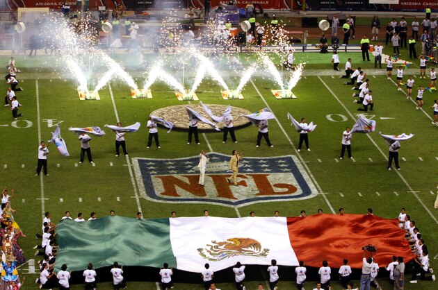 Performers prior to the start of the regular season NFL game between the Arizona Cardinals and San Francisco 49ers at Azteca Stadium in Mexico City, Mexico on Sunday Oct. 2, 2005. ( (AP Photo/Marco Ugargte)