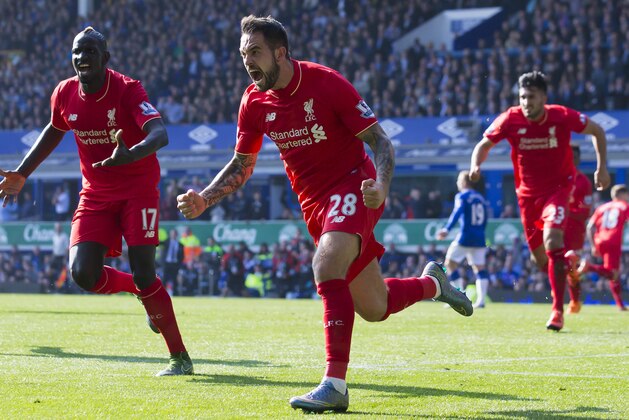 Liverpool's Danny Ings, centre, celebrates after scoring during the English Premier League soccer match between Everton and Liverpool at Goodison Park Stadium, Liverpool, England, Sunday Oct. 4, 2015. (AP Photo/Jon Super)