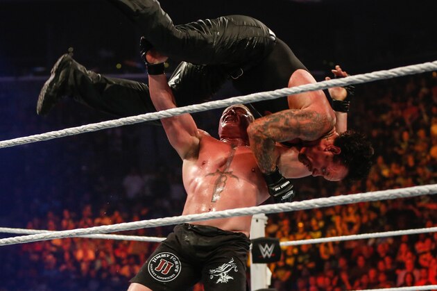 NEW YORK, NY - AUGUST 23:  Brock Lesnar and The Undertaker battle it out at the WWE SummerSlam 2015 at Barclays Center of Brooklyn on August 23, 2015 in New York City.  (Photo by JP Yim/Getty Images)