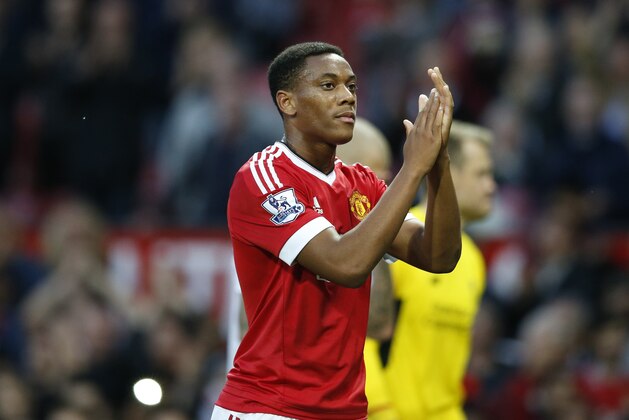 Manchester United's Anthony Martial applauds the crowd after the English Premier League soccer match between Manchester United and Liverpool at Old Trafford Stadium, Manchester, England, Saturday, Sept. 12, 2015. (AP Photo/Jon Super)