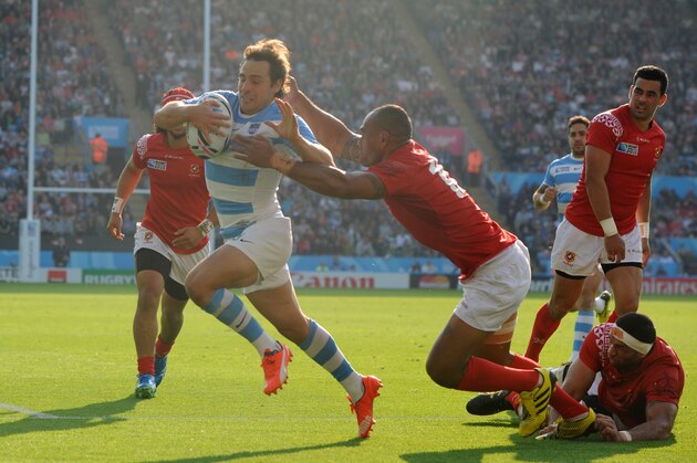 Argentina's Nicolas Sanchez breaks free from a tackle during the Rugby World Cup Pool C match between Argentina and Tonga at the Leicester City Stadium, Leicester, England, Sunday, Oct. 4, 2015. (AP Photo/Rui Vieira)