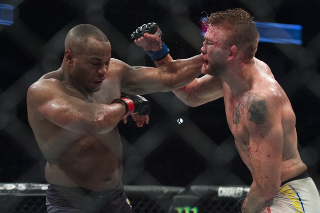 HOUSTON, TX - OCTOBER 3:  Daniel Cormier connects with a punch against Alexander Gustafsson during UFC 192 at the Toyota Center on October 3, 2015 in Houston, Texas. (Photo by Cooper Neill/Zuffa LLC/Zuffa LLC via Getty Images)