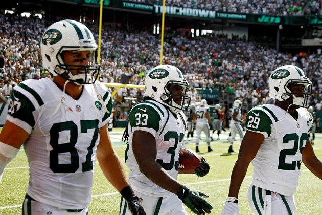 EAST RUTHERFORD, NJ - SEPTEMBER 07:   Chris Ivory #33 of the New York Jets walks back with teammates  Eric Decker #87 and  Bilal Powell #29 after a fourth quarter touchdown run against the Oakland Raiders at MetLife Stadium on September 7, 2014 in East Rutherford, New Jersey.  (Photo by Jeff Zelevansky/Getty Images)