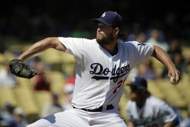Los Angeles Dodgers starting pitcher Clayton Kershaw  throws against the Arizona Diamondbacks during the first inning of a baseball game in Los Angeles, Thursday, Sept. 24, 2015. (AP Photo/Chris Carlson)