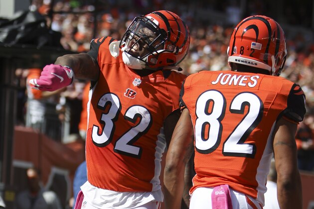 Cincinnati Bengals running back Jeremy Hill (32) celebrates after scoring a touchdown in the first half of a NFL football game against the Kansas City Chiefs, Sunday, Oct. 4, 2015, in Cincinnati. (AP Photo/Frank Victores)
