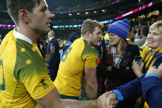 Australia's Bernard Foley and David Pocock are greeted by the crowd after the Rugby World Cup Pool A match between England and Australia at Twickenham stadium in London, Saturday, Oct. 3, 2015. Australia won the match 33-13.  (AP Photo/Alastair Grant)