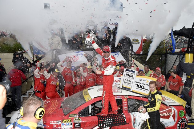 Kevin Harvick celebrates in Victory Lane after he won the NASCAR Sprint Cup series auto race, Sunday, Oct. 4, 2015, at Dover International Speedway in Dover, Del. (AP Photo/Nick Wass)