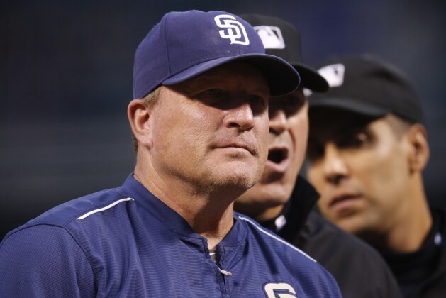 San Diego Padres interim manager Pat Murphy (24) confers with umpires while handing in the lineup before facing the Colorado Rockies in the first inning of a baseball game Friday, Sept. 18, 2015, in Denver. (AP Photo/David Zalubowski) San Diego Padres interim manager Pat Murphy (24) confers with umpires while handing in the lineup before facing the Colorado Rockies in the first inning of a baseball game Friday, Sept. 18, 2015, in Denver. (AP Photo/David Zalubowski)
