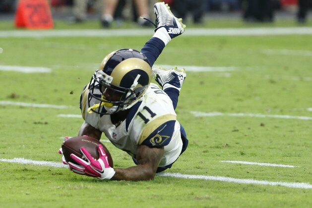St. Louis Rams wide receiver Tavon Austin (11) lunges for the end zone for a touchdown against the Arizona Cardinals during the second half of an NFL football game, Sunday, Oct. 4, 2015, in Glendale, Ariz. (AP Photo/Ross D. Franklin)