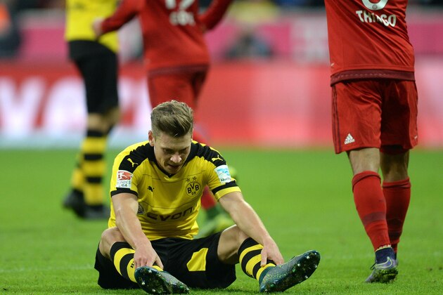 Dortmund's Polish defender Lukasz Piszczek sits on the pitch after the fifth goal for Munich during the German first division Bundesliga football match FC Bayern Munich vs Borussia Dortmund in Munich, southern Germany, on October 4, 2015.  AFP PHOTO / CHRISTOF STACHE


RESTRICTIONS: DURING MATCH TIME: DFL RULES TO LIMIT THE ONLINE USAGE TO 15 PICTURES PER MATCH AND FORBID IMAGE SEQUENCES TO SIMULATE VIDEO. 
== RESTRICTED TO EDITORIAL USE ==
FOR FURTHER QUERIES PLEASE CONTACT DFL DIRECTLY AT + 49 69 650050.        (Photo credit should read CHRISTOF STACHE/AFP/Getty Images)