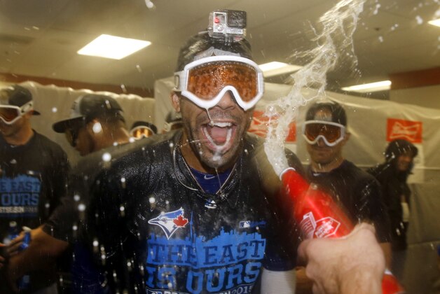Toronto Blue Jays pitcher David Price celebrates with teammates after the second baseball game of a doubleheader against the Baltimore Orioles, Wednesday, Sept. 30, 2015, in Baltimore. Toronto clinched the American League East after winning the first game 15-2. (AP Photo/Patrick Semansky)