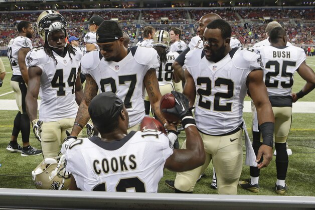 New Orleans Saints wide receiver Brandin Cooks is given the ball by running back Mark Ingram (22) after Cooks scored during the third quarter of a preseason NFL football game against the St. Louis Rams on Friday, Aug. 8, 2014, in St. Louis. (AP Photo/Scott Kane) New Orleans Saints wide receiver Brandin Cooks is given the ball by running back Mark Ingram (22) after Cooks scored during the third quarter of a preseason NFL football game against the St. Louis Rams on Friday, Aug. 8, 2014, in St. Louis. (AP Photo/Scott Kane)