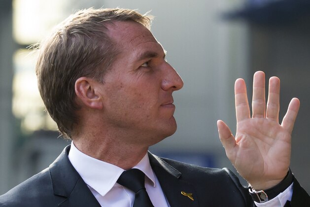 Liverpool's manager Brendan Rodgers takes to the touchline before the English Premier League soccer match between Everton and Liverpool at Goodison Park Stadium, Liverpool, England, Sunday Oct. 4, 2015. Liverpool has fired manager Brendan Rodgers after three years in charge of the Premier League club. The dismissal came after a 1-1 draw in the Merseyside derby against Everton on Sunday. The club came close in the 2013-14 season to winning the league for the first time since 1990 but it was way off last season.  (AP Photo/Jon Super)