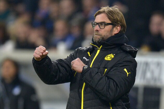 Dortmund's head coach Juergen Klopp reacts as his team scores its 2nd goal during the German first division Bundesliga football match 1899 Hoffenheim vs Borussia Dortmund in Sinsheim, southwestern Germany, on December 14, 2013.     AFP PHOTO / THOMAS KIENZLE

RESTRICTIONS - DFL RULES TO LIMIT THE ONLINE USAGE DURING MATCH TIME TO 15 PICTURES PER MATCH.  FOR FURTHER QUERIES PLEASE  CONTACT THE  DFL DIRECTLY AT + 49 69 650050.        (Photo credit should read THOMAS KIENZLE/AFP/Getty Images)