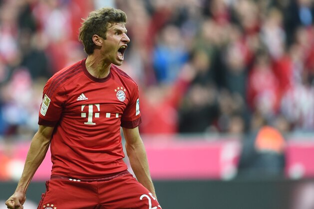 Bayern's Thomas Mueller celebrates after scoring his opening goal during the Bundesliga soccer match between FC Bayern Munich and Borussia Dortmund at the Allianz Arena stadium in Munich, Germany, Sunday, Oct. 4, 2015. (Andreas Gebert/dpa via AP)