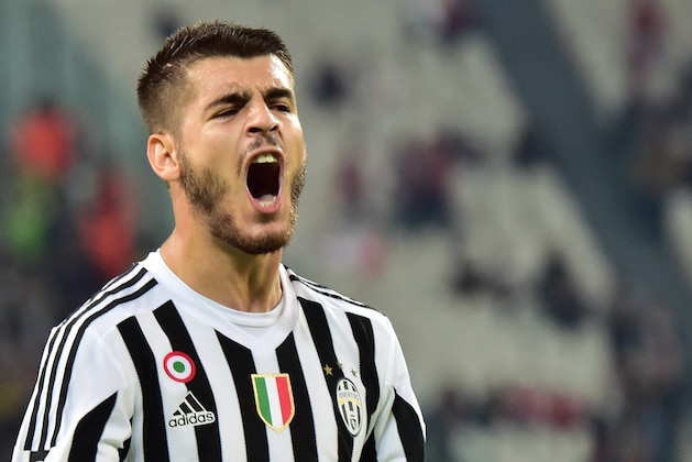 Juventus' forward from Spain Alvaro Morata celebrates after scoring during the UEFA Champions League football match Juventus vs FC Sevilla on September 30 at the Juventus stadium in Turin.   AFP PHOTO / GIUSEPPE CACACE        (Photo credit should read GIUSEPPE CACACE/AFP/Getty Images)