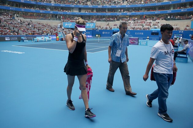 BEIJING, CHINA - OCTOBER 05:  Eugenie Bouchard of Canada leaves the court after she retires injured in her match against Andrea Petkovic of Germany during the day three of the 2015 China Open at the China National Tennis Centreon October 5, 2015 in Beijing, China.  (Photo by Emmanuel Wong/Getty Images)