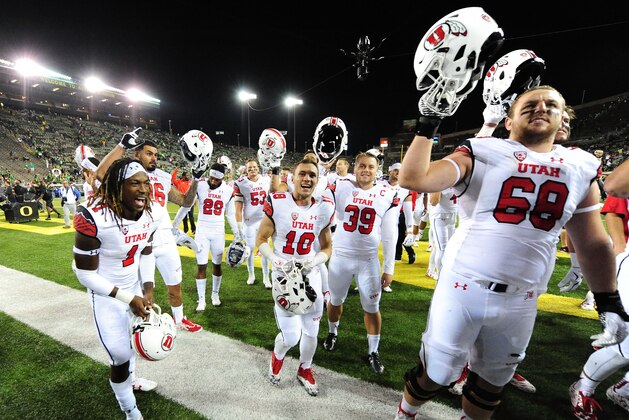EUGENE, OR - SEPTEMBER 26: The Utah Utes celebrate with fans after they beat the Oregon Ducks 62-20 at Autzen Stadium on September 26, 2015 in Eugene, Oregon.  (Photo by Steve Dykes/Getty Images)