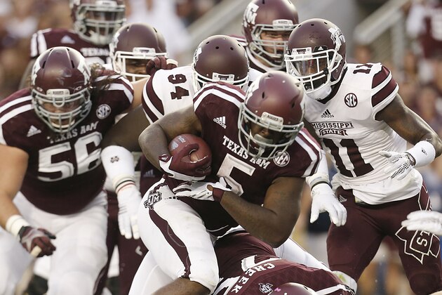 COLLEGE STATION, TX - OCTOBER 03: Tra Carson #5 of the Texas A&M Aggies rushes agains the Mississippi State Bulldogs in the first quarter on October 3, 2015 at Kyle Field in College Station, Texas. (Photo by Thomas B. Shea/Getty Images)