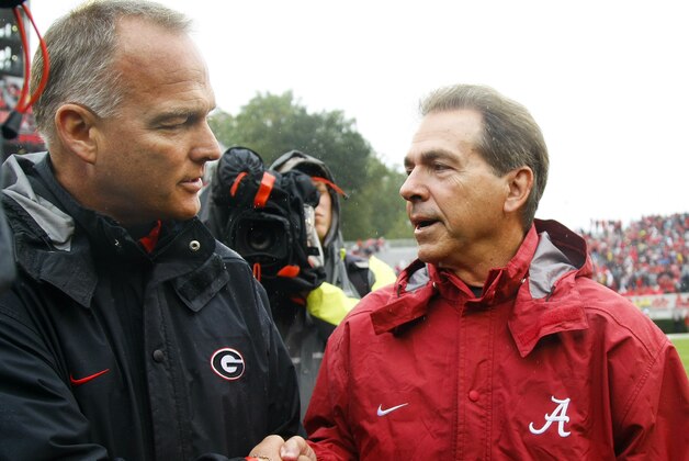 Georgia head coach Mark Richt, left, and Alabama head coach Nick Saban shake hands before their NCAA college football game, Saturday, Oct. 3, 2015, in Athens, Ga. (AP Photo/Brett Davis)