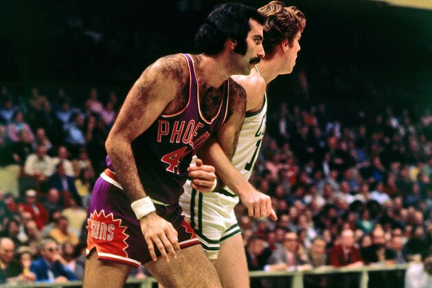 BOSTON - 1973:  Neal Walk #42 of the Phoenix Suns boxes out against Dave Cowens #18 of the Boston Celtics during a game played in 1973 at the Boston Garden in Boston, Massachusetts. NOTE TO USER: User expressly acknowledges and agrees that, by downloading and or using this photograph, User is consenting to the terms and conditions of the Getty Images License Agreement. Mandatory Copyright Notice: Copyright 1973 NBAE (Photo by Dick Raphael/NBAE via Getty Images)