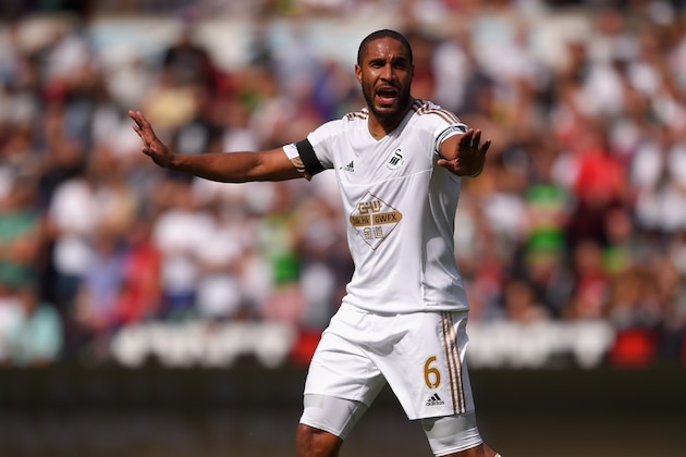 SWANSEA, WALES - AUGUST 15:  Swansea captain Ashley Williams in action during the Barclays Premier League match between Swansea City and Newcastle United at the Liberty stadium on August 15, 2015 in Swansea, United Kingdom.  (Photo by Stu Forster/Getty Images)