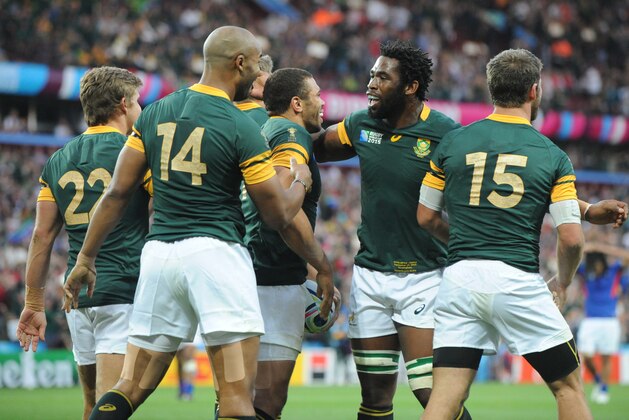 South Africa players celebrate their 46-6 win in the Rugby World Cup Pool B match between South Africa and Samoa at Villa Park, Birmingham, England, Saturday, Sept. 26, 2015. (AP Photo/Rui Vieira)