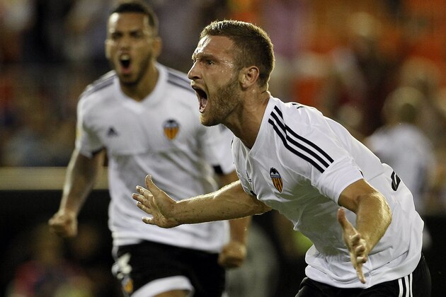 Valencia's German defender Shkodran Mustafi celebrates his goal during the Spanish league football match Valencia CF vs Granada CF at the Mestalla stadium in Valencia on September 25, 2015.  AFP PHOTO / JOSE JORDAN        (Photo credit should read JOSE JORDAN/AFP/Getty Images)