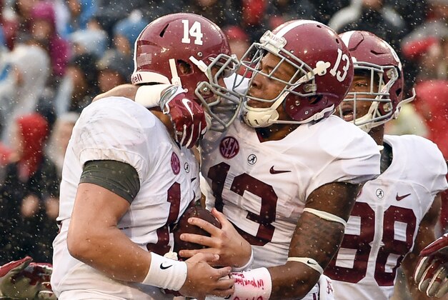 Oct 3, 2015; Athens, GA, USA; Alabama Crimson Tide quarterback Jake Coker (14) celebrates a touchdown during the third quarter against the Georgia Bulldogs at Sanford Stadium. Alabama defeated Georgia 38-10. Mandatory Credit: Dale Zanine-USA TODAY Sports