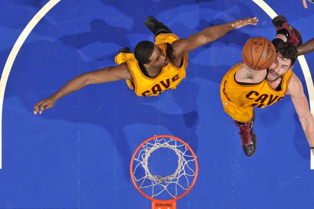 ORLANDO, FL - DECEMBER 26:  Kevin Love #0 and Tristan Thompson #13 of the Cleveland Cavaliers go up for a rebound against the Orlando Magic during the game on December 26, 2014 at Amway Center in Orlando, Florida. NOTE TO USER: User expressly acknowledges and agrees that, by downloading and or using this photograph, User is consenting to the terms and conditions of the Getty Images License Agreement. Mandatory Copyright Notice: Copyright 2014 NBAE (Photo by Fernando Medina/NBAE via Getty Images)