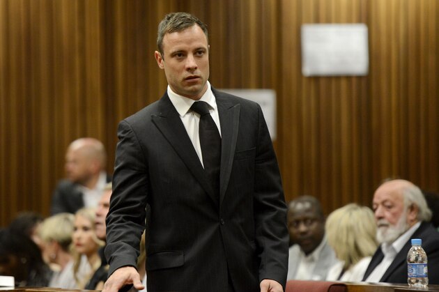 Oscar Pistorius arrives in court in Pretoria, South Africa, Tuesday, Oct. 21, 2014. Pistorius will finally learn his fate  when judge Thokozile Masipais is expected to announce the Olympic runner's sentence for killing girlfriend Reeva Steenkamp  (AP Photo/Herman Verwey, Pool)