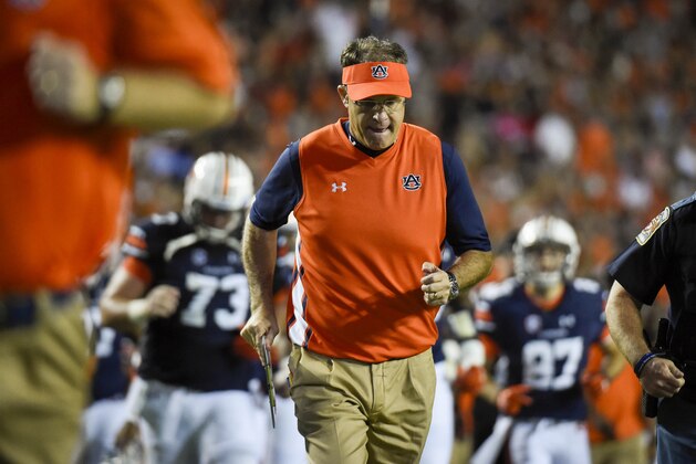 Sep 26, 2015; Auburn, AL, USA; Auburn Tigers head coach Gus Malzahn runs off the field after the second quarter at Jordan Hare Stadium. Mandatory Credit: Shanna Lockwood-USA TODAY Sports