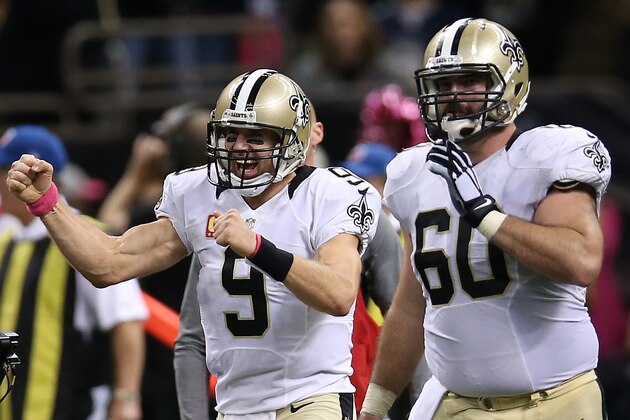 NEW ORLEANS, LA - OCTOBER 04:  Drew Brees #9 of the New Orleans Saints celebrates after throwing his 400th touchdown pass to  C.J. Spiller #28 of the New Orleans Saints in overtime to defeat the Dallas Cowboys 26-20 at Mercedes-Benz Superdome on October 4, 2015 in New Orleans, Louisiana.  (Photo by Chris Graythen/Getty Images)