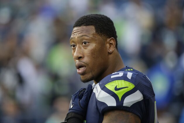 Seattle Seahawks outside linebacker Bruce Irvin on the sideline during a preseason NFL football game against the Oakland Raiders, Thursday, Sept. 3, 2015, in Seattle. (AP Photo/Elaine Thompson)