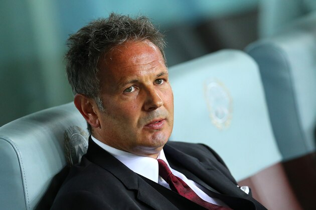 AC Milan coach Sinisa Mihajlovic sits on the bench during the Serie A soccer match between Udinese and AC Milan at the Friuli Stadium in Udine, Italy, Tuesday, Sept. 22, 2015. (AP Photo/Paolo Giovannini)