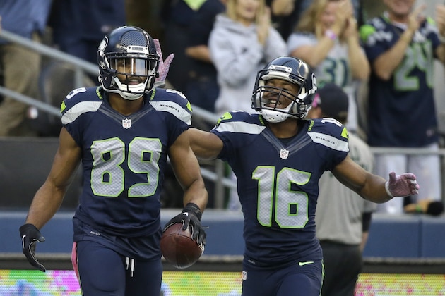 Seattle Seahawks wide receiver Doug Baldwin (89) is greeted by wide receiver Tyler Lockett (16), after Baldwin scored a touchdown in the first half of an NFL football game against the Detroit Lions, Monday, Oct. 5, 2015, in Seattle. (AP Photo/Elaine Thompson)