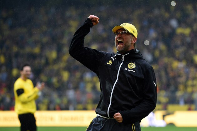 Dortmund's head coach Juergen Klopp celebrates after the German first division Bundesliga football match between Borussia Dortmund and SV Werder Bremen at the Signal Iduna Park in Dortmund, western Germany on May 23, 2015. Dortmund won the match 3-2. AFP PHOTO / PATRIK STOLLARZ

RESTRICTIONS - DFL RULES TO LIMIT THE ONLINE USAGE DURING MATCH TIME TO 15 PICTURES PER MATCH. IMAGE SEQUENCES TO SIMULATE VIDEO IS NOT ALLOWED AT ANY TIME. FOR FURTHER QUERIES PLEASE CONTACT DFL DIRECTLY AT + 49 69 650050.        (Photo credit should read PATRIK STOLLARZ/AFP/Getty Images)