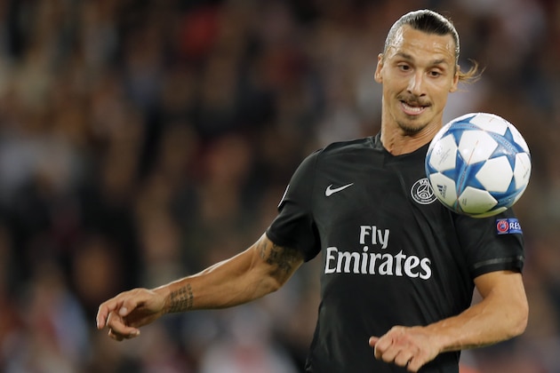 PSG's Zlatan Ibrahimovic eyes the ball during the Champions League Group A soccer match between PSG and Malmo at the Parc des Princes stadium in Paris, France, Tuesday, Sept. 15, 2015. (AP Photo/Francois Mori)
