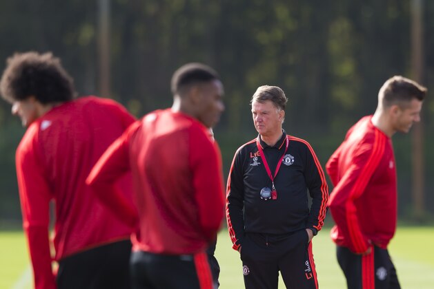 Manchester United's manager Louis van Gaal, centre right, watches his team train at Carrington training ground in Manchester, England, Tuesday, Sept. 29, 2015. Manchester United will play VFL Wolfsberg in a Champions League group B soccer match on Wednesday. (AP Photo/Jon Super)