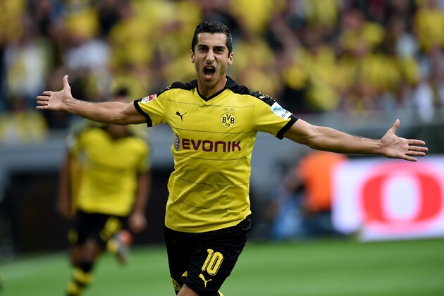 Dortmund's Armenian midfielder Henrikh Mkhitaryan reacts during the German first division Bundesliga football match Borussia Dortmund vs Borussia Moenchengladbach in Dortmund, western Germany, on August 15, 2015.  AFP PHOTO / PATRIK STOLLARZ

RESTRICTIONS: DURING MATCH TIME: DFL RULES TO LIMIT THE ONLINE USAGE TO 15 PICTURES PER MATCH AND FORBID IMAGE SEQUENCES TO SIMULATE VIDEO. 
== RESTRICTED TO EDITORIAL USE ==
FOR FURTHER QUERIES PLEASE CONTACT DFL DIRECTLY AT + 49 69 650050.        (Photo credit should read PATRIK STOLLARZ/AFP/Getty Images)