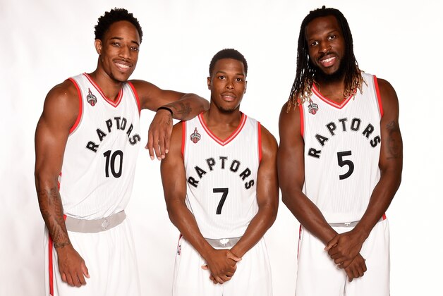TORONTO, CANADA - SEPTEMBER 28:  DeMar DeRozan #10, Kyle Lowry #7, and DeMarre Carroll #5 of the Toronto Raptors poses for a photo during media day on September 28, at the Air Canada Centre in Toronto, Ontario, Canada.  NOTE TO USER: User expressly acknowledges and agrees that, by downloading and or using this Photograph, user is consenting to the terms and conditions of the Getty Images License Agreement.  Mandatory Copyright Notice: Copyright 2015 NBAE (Photo by Ron Turenne/NBAE via Getty Images)
