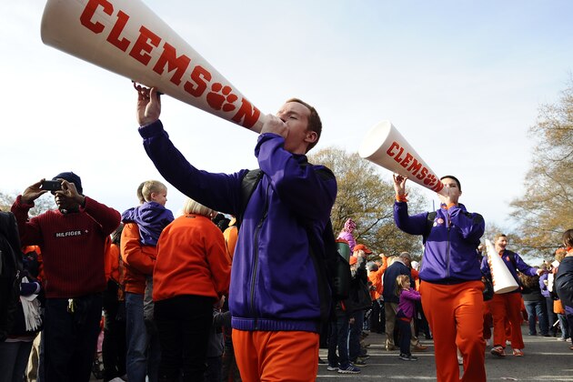 Members of the Clemson cheer squad perform during the Tiger Walk before an NCAA college football game against South Carolina, Saturday, Nov. 29, 2014, in Clemson, S.C. (AP Photo/Rainier Ehrhardt)