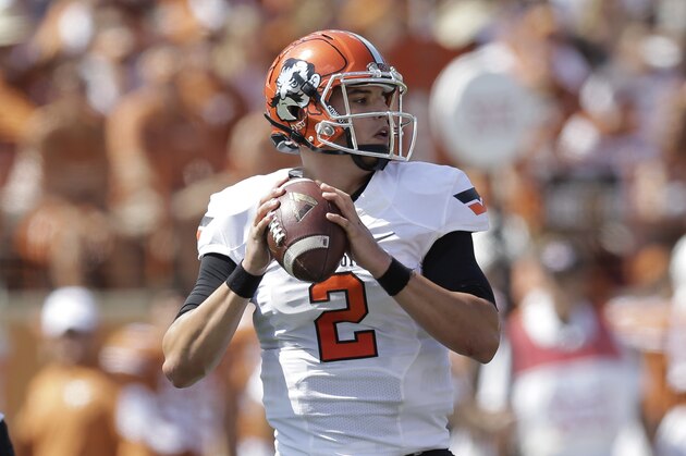 Oklahoma State's Mason Rudolph (2) throws against Texas during the first half of an NCAA college football game, Saturday, Sept. 26, 2015, in Austin, Texas. (AP Photo/Eric Gay)
