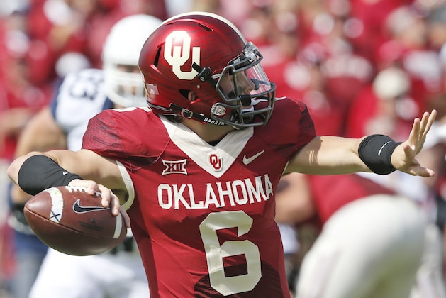Oklahoma quarterback Baker Mayfield (6) passes in the second quarter of an NCAA college football game against West Virginia in Norman, Okla., Saturday, Oct. 3, 2015. (AP Photo/Sue Ogrocki)