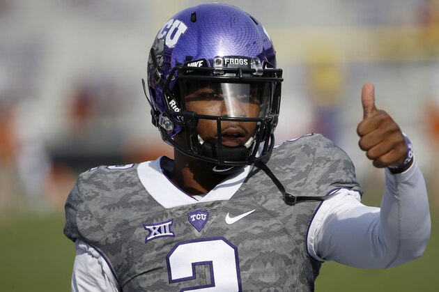 TCU quarterback Trevone Boykin gestures to a teammate before TCU takes on the Texas in a NCAA football game Saturday, Oct. 3, 2015, in Fort Worth, Texas. (AP Photo/Ron Jenkins)