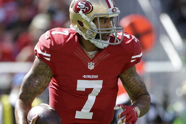 San Francisco 49ers quarterback Colin Kaepernick (7) runs against the Green Bay Packers during the first half of an NFL football game in Santa Clara, Calif., Sunday, Oct. 4, 2015. (AP Photo/Marcio Jose Sanchez)