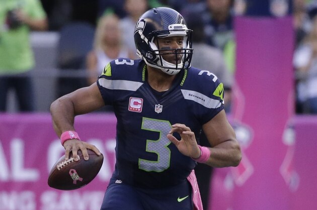 Seattle Seahawks quarterback Russell Wilson in action against the Detroit Lions in an NFL football game, Monday, Oct. 5, 2015, in Seattle. (AP Photo/Elaine Thompson)