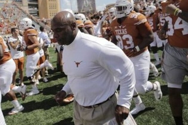 Texas head coach Charlie Strong takes the field with his team before an NCAA college football game against Oklahoma State, Saturday, Sept. 26, 2015, in Austin, Texas. (AP Photo/Eric Gay)