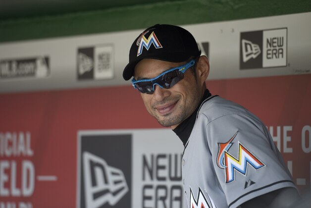 Miami Marlins' Ichiro Suzuki, of Japan, looks on from the dugout before a baseball game against the Washington Nationals, Sunday, Sept. 20, 2015, in Washington. (AP Photo/Nick Wass)