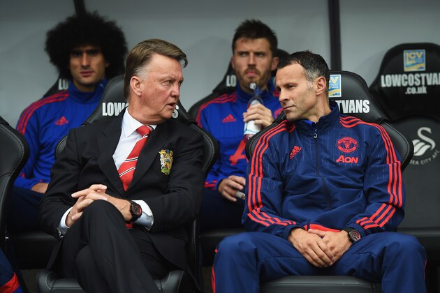 SWANSEA, WALES - AUGUST 30:  Louis van Gaal, manager of Manchester United talks to assistant Ryan Giggs during the Barclays Premier League match between Swansea City and Manchester United at Liberty Stadium on August 30, 2015 in Swansea, Wales.  (Photo by Michael Regan/Getty Images)